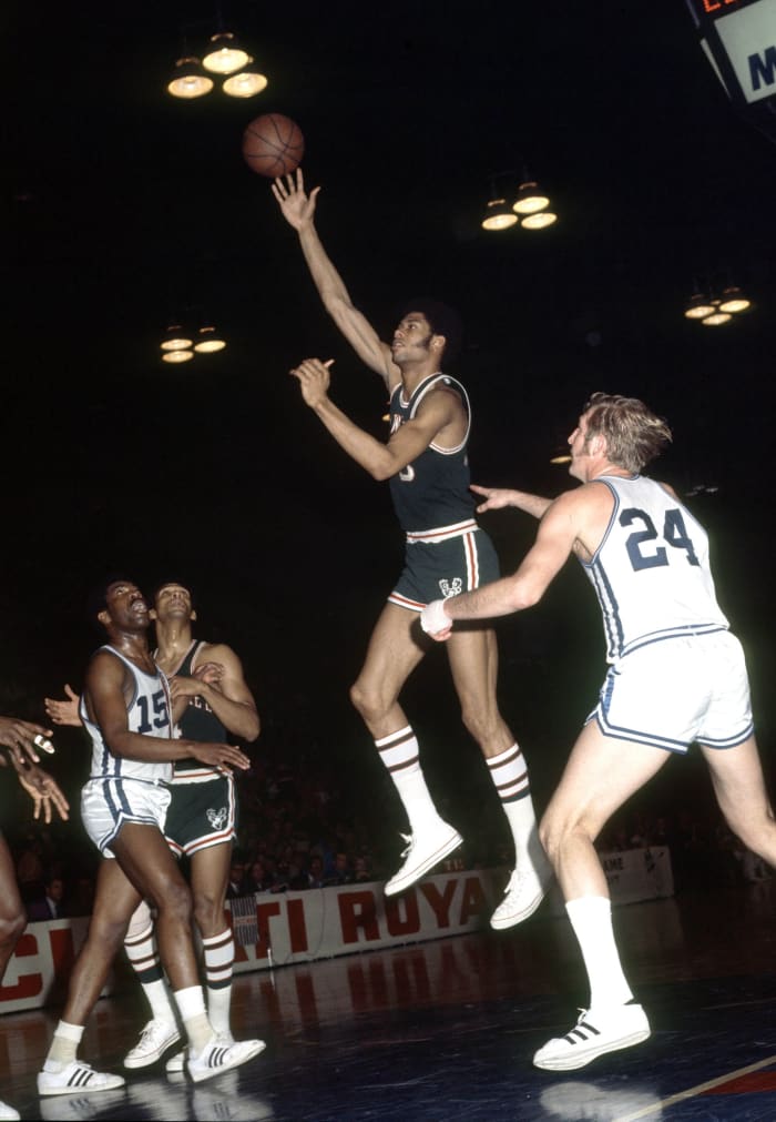 Milwaukee Bucks center Lew Alcindor later known as Kareem Abdul-Jabbar in action against the Cincinnati Royals